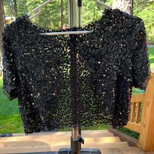 Black sequin short cropped dress jacket.